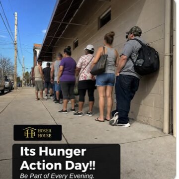 Neighbors lining up along a sidewalk outside Hosea House, captioned Its Hunger Action Day, be part of every evening